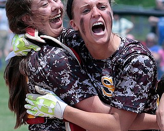 05282016- South Range Raiders' Morgan Czopur(20) and Hanna Dennison (16) celebrate after winning the Division III regional finals against Northwestern 1-0. Michael Taylor | The Vindicator