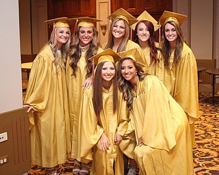 Nikos Frazier | The Vindicator..A group of students from Cardinal Mooney High School pose for a picture in Stambaugh Auditorium before walking upstairs to receive their diplomas.