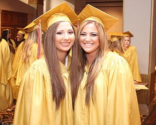 Nikos Frazier | The Vindicator..Lexy Herman(left) poses next to Julie Cook(right) before walking upstairs to receive their diplomas from Cardinal Mooney High School.