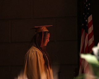 Nikos Frazier | The Vindicator..Julie Cook waits to walk on stage at Stambaugh Auditorium to receive her diploma from Cardinal Mooney High School.