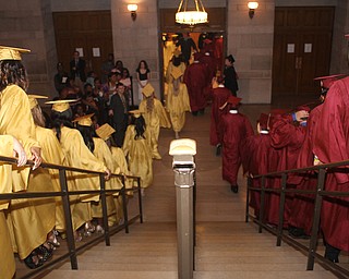 Nikos Frazier | The Vindicator..After receiving their diplomas from Cardinal Mooney High School, the class of 2016 walk downstairs to greet their families.
