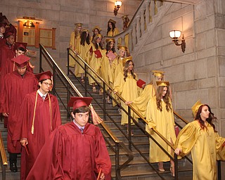 Nikos Frazier | The Vindicator..After receiving their diplomas from Cardinal Mooney High School, the class of 2016 walk downstairs to greet their families.