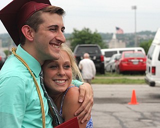 Nikos Frazier | The Vindicator..Gino Ginnetti(left) poses with Kirsten Appel after graduating from Cardinal Mooney High School.