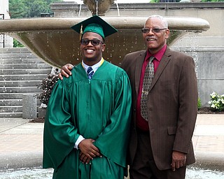 Nikos Frazier | The Vindicator..Ryan Stuart(left) poses with his grandfather, Mark Scott outside of Stambaugh Auditorium before the 2016 Ursline High School commencement on Sunday, May 29, 2016.