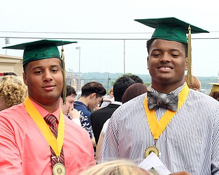 Nikos Frazier | The Vindicator..Deion Edwards(left) and Jabbar Price(right) pose for pictures outside of Stambaugh Auditorium after graduating from Ursline High School.