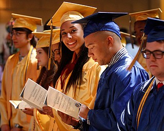 ROBERT K. YOSAY | THE VINDICATOR..Graduates check out their names.. as the ceremony....started..Valley Christian Schools --Highway Tabernacle Church..almost 40 graduates celebrated graduation - ..-30-