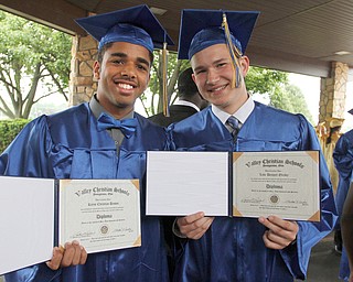 ROBERT K. YOSAY | THE VINDICATOR..Proud day as Kanye Christian Brown aand Luke Bennett Olesky show off thier diplomas..Valley Christian Schools --Highway Tabernacle Church..almost 40 graduates celebrated graduation - ..-30-