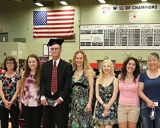 Honorary veteran graduate, Robert Wallace (center) poses for a picture with his family after he was given a diploma during the Struthers High School Commencement on Sunday afternoon. Dustin Livesay | The Vindicator 5/29/16 Struthers High School (the whole famile left and I could not get names. )