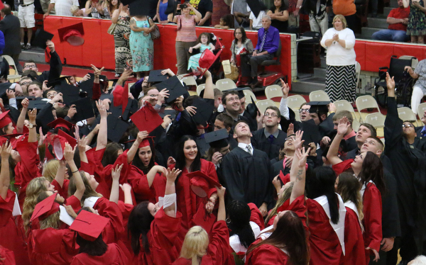 The graduating class of Struthers High School throw iup their caps after singing the alma mater to conclude the Struthers High School Commencement on Sunday afternoon.   Dustin Livesay   |   The Vindicator 5/29/16  Struthers High School