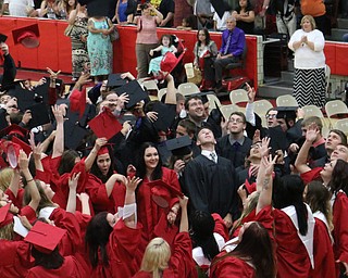 The graduating class of Struthers High School throw iup their caps after singing the alma mater to conclude the Struthers High School Commencement on Sunday afternoon. Dustin Livesay | The Vindicator 5/29/16 Struthers High School