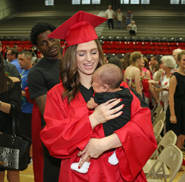 Struthers graduate Alexis Gleydura holds her six month old son, Keith Lawrence III,  after she received her diploma during the Struthers High School Commencement on Sunday afternoon.   Dustin Livesay   |   The Vindicator 5/29/16  Struthers High School