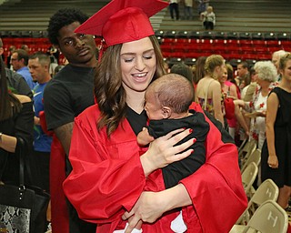 Struthers graduate Alexis Gleydura holds her six month old son, Keith Lawrence III, after she received her diploma during the Struthers High School Commencement on Sunday afternoon. Dustin Livesay | The Vindicator 5/29/16 Struthers High School