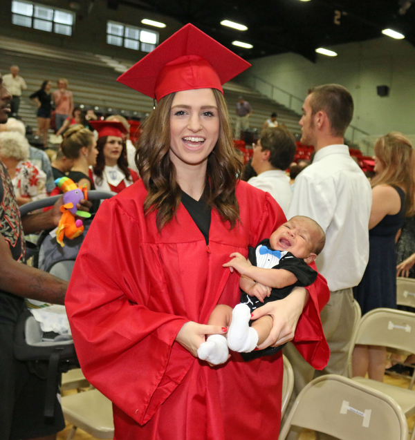 Struthers graduate Alexis Gleydura holds her six month old son after she received her diploma during the Struthers High School Commencement on Sunday afternoon.   Dustin Livesay   |   The Vindicator 5/29/16  Struthers High School