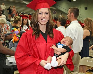 Struthers graduate Alexis Gleydura holds her six month old son after she received her diploma during the Struthers High School Commencement on Sunday afternoon. Dustin Livesay | The Vindicator 5/29/16 Struthers High School