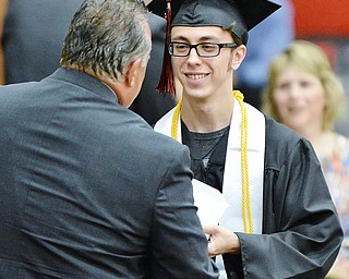 Jeff Lange | The Vindicator SUN, MAY 29, 2016 - Isaac Beach smiles as he receives his high school diploma during Sunday's commencement at Girard High School.
