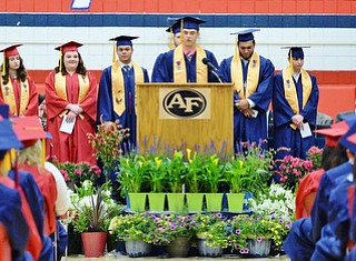 Jeff Lange | The Vindicator SUN, MAY 29, 2016 - Austin Coulter (center) delivers a speech to his peers during Sunday's commencement at Austintown Fitch High School.