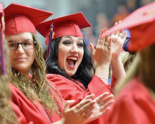Jeff Lange | The Vindicator SUN, MAY 29, 2016 - Alana DeFranco (center) claps in excitement as names are called during Sunday's commencement at Austintown Fitch High School.