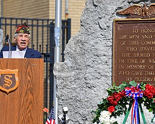 STRUTHERS, OHIO - MAY 30, 2016: Ray Ornelas of the Veterans Service Commission speaks at the podium Monday morning during a fallen soldier memorial dedication at Struthers High School. DAVID DERMER | THE VINDICATOR