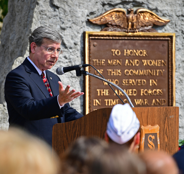 STRUTHERS, OHIO - MAY 30, 2016: Michael A. Shepherd the chaplain of the Tri-State Marine Corps League Detachment #494 speaks at the podium Monday morning during a fallen soldier memorial dedication at Struthers High School. DAVID DERMER | THE VINDICATOR