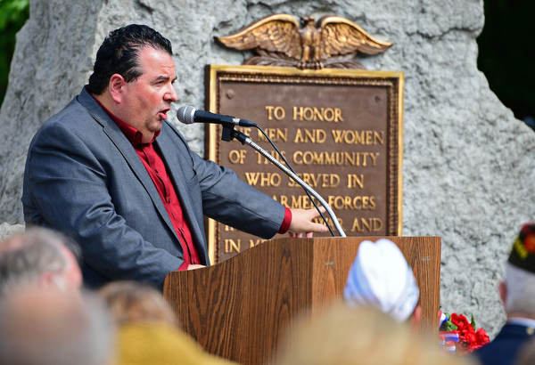 STRUTHERS, OHIO - MAY 30, 2016: Mahoning County Commissioner Anthony Traficanti speaks at the podium Monday morning during a fallen soldier memorial dedication at Struthers High School. DAVID DERMER | THE VINDICATOR