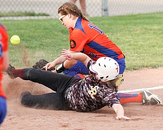 William D. Lewis\The Vindicator.South Range's Madison Weaver(8) is safe at third as Edison's Jessica Stoll(10) loses the ball during June 2, 2016 game in Akron.