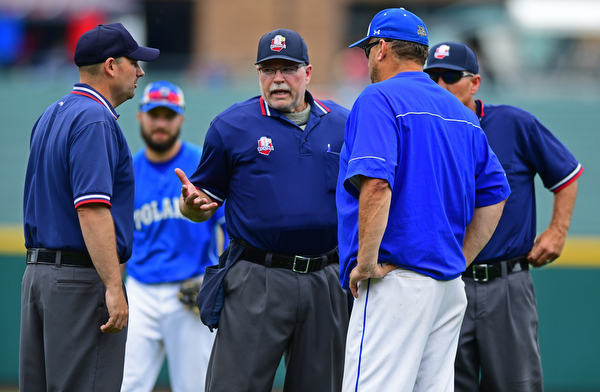COLUMBUS, OHIO - JUNE 2, 2016: Manager Rich Murry of Poland gets a explanation after a controversial call that was overturned by the third base umpire in the seventh inning of Thursday afternoons Division Two State Semi-Final game at Huntington Park. Hamilton Badin won 8-3. DAVID DERMER | THE VINDICATOR
