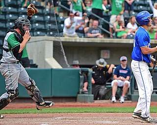 COLUMBUS, OHIO - JUNE 2, 2016: Tony Chairo #20 of Poland shows his frustration after striking out to end the game while catcher Cody Boxrucker #20 of Hamilton Badin celebrates behind him in the seventh inning of Thursday afternoons Division Two State Semi-Final game at Huntington Park. Hamilton Badin won 8-3. DAVID DERMER | THE VINDICATOR