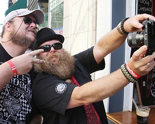 William D. Lewis\The Vindicator.John Hamblen, left, and Todd Dupler, both of Cincinnati.take a selfie at the Burgers and Beards event in Youngstown June 3,2016. The wo will particiapte in hte beard contest..