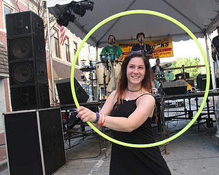 William D. Lewis\The Vindicator.Cassie Roth of Boardman dances with a Hula Hoop to the band Bees Trees at Burgers and Bears event in downtown Youngstown June, 3, 2016.