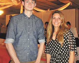 SPECIAL TO THE VINDICATOR
Mike Guyer, left, a recent graduate of Girard High School, is the recipient of a scholarship provided by CR Electric Inc. Guidance teacher, Angela Cochran, presented the award at the senior banquet. It was given to a first year engineering student at Youngstown State University. Mike is the son of Dan and Judy Guyer of Girard.
