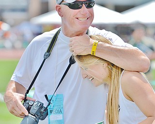 Jeff Lange | The Vindicator  FRI, JUN 3, 2016 - Brian Fedyski of McDonald wraps his arm around Sara Joseph after Joseph and her 4x400 meter relay team placed second in the Division III 4x400 meter relay finals with a time of 3:59.91 during Friday's OHSAA State Track and Field Tournament at Jesse Owens Memorial Stadium in Columbus.