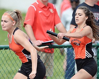 Jeff Lange | The Vindicator  FRI, JUN 3, 2016 - Springfield's Haley LaMorticella (right) hands the baton off to Cierra Latronica as they compete in the girls 4x200 meter relay race during Friday's OHSAA State Track and Field tournament at Jesse Owens Memorial Stadium. Springfield finished fourth with a time of1:46.66.