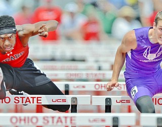 Jeff Lange | The Vindicator  FRI, JUN 3, 2016 - Girard's Collin Harden (left) competes against Wooster Triway's Mason Plant in the boys 110 meter hurdles event during Friday's OHSAA State Track and Field tournament at Jesse Owens Memorial Stadium. Harden finished eighth with a qualifying time of 14.64 seconds.