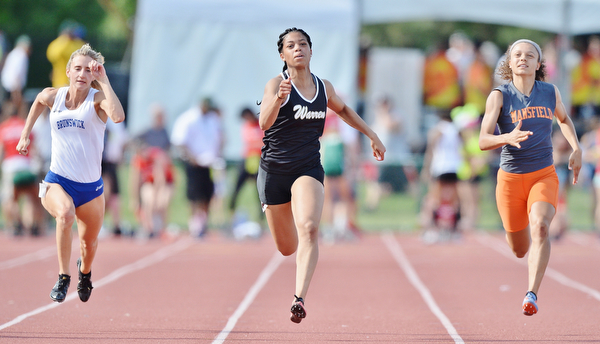 Jeff Lange | The Vindicator  FRI, JUN 3, 2016 - Harding's Justice Richardson (center) sprints down the track against Brunswick's Bailey Lack (left) and Mansfield's Alaysia Grose in the girls 100 meter dash event during the OHSAA State Track and Field tournament at Jesse Owens Memorial Stadium in Columbus on Friday. Richardson placed second in her heat with a qualifying time of 12.01 seconds.
