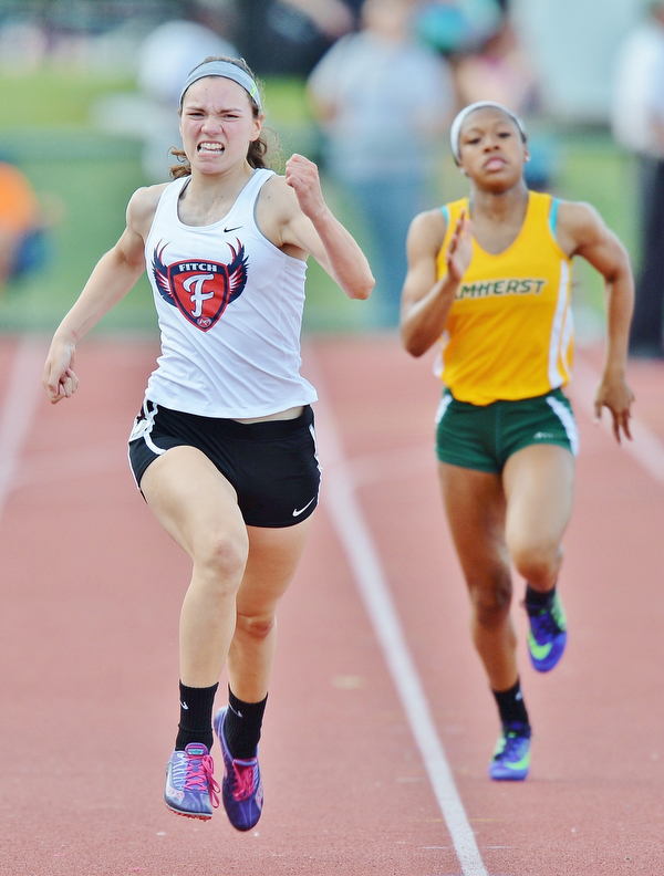 Jeff Lange | The Vindicator  FRI, JUN 3, 2016 - Austintown Fitch's Lauren Dolak (left) grits her teeth as she sprints to the finish in the girls 200 meter running event during the OHSAA State Track and Field tournament in Columbus on Friday.