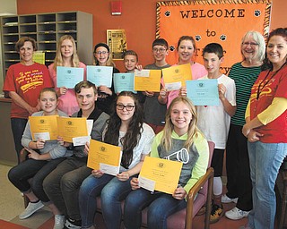 SPECIAL TO THE VINDICATOR
Kiwanis Club of Newton Falls conducted an essay contest with the cooperation of the seventh grade English teachers at Newton Falls Junior High School. The teachers selected the top 10 essays and from those, the NFHS Key Club, a high school branch of Kiwanis, selected the top six. The essays were to be persuasive and were written about the student’s favorite charity. The charities of the top six have received the names of students and copies of the essays. All 10 winners are included and seated, from left, are Stephanie Kover, Austin Cline, Jo Christy and Hannah Decker. Standing are Joyce Clay, teacher; Chloe Maas; Madison Haidet; Brandon Gibson; Adam Machi; Maddie Fowler; Nick Oyster; Kathy Wujcik, Kiwanis treasurer; and Jennifer Schlaubach, teacher.