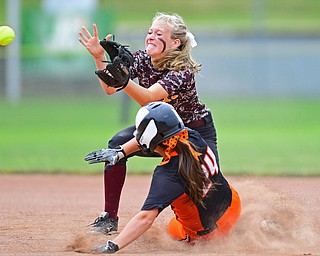AKRON, OHIO - JUNE 4, 2016: Short stop Codi Taylor #4 of South Range fields the ball while Taylor McQuay #24 of Wheelersburg slides into second base for a RBI double in the second inning of Saturday afternoons Division 3 State Title game at Firestone Stadium. Wheelersburg won 8-3. DAVID DERMER | THE VINDICATOR