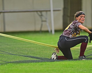 AKRON, OHIO - JUNE 4, 2016: Left fielder Morgan Caopur #20 of South Range gets to her feet after falling into the collapsable outfield fence while attempting to field the ball after a RBI Triple by Breanna Klaiber #34 of Wheelersburg in the sixth inning of Saturday afternoons Division 3 State Title game at Firestone Stadium. Wheelersburg won 8-3. DAVID DERMER | THE VINDICATOR