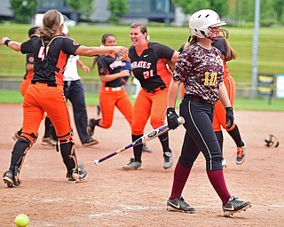 AKRON, OHIO - JUNE 4, 2016: Hope Thomas #10 of South Range walks to the dugout after striking out while the Wheelersburg players celebrate winning on the infield after the seventh inning of Saturday afternoons Division 3 State Title game at Firestone Stadium. Wheelersburg won 8-3. DAVID DERMER | THE VINDICATOR