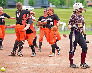 AKRON, OHIO - JUNE 4, 2016: Hope Thomas #10 of South Range walks to the dugout after striking out while the Wheelersburg players celebrate winning on the infield after the seventh inning of Saturday afternoons Division 3 State Title game at Firestone Stadium. Wheelersburg won 8-3. DAVID DERMER | THE VINDICATOR