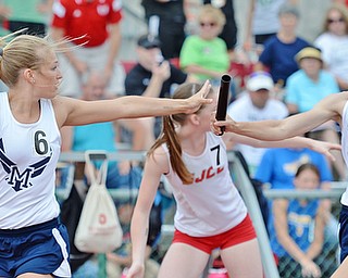Jeff Lange | The Vindicator SAT, JUN 4, 2016 - McDonald's Iva Domitrovich (right) hands the baton off to teammate Sara Joseph as they compete in the Division III girls 4x400 meter relay race during Saturday's OHSAA State Track and Field meet in Columbus. The team finished first with a time of 3:57.58.
