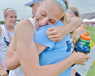 Jeff Lange | The Vindicator SAT, JUN 4, 2016 - McDonald's Iva Domitrovich (facing) hugs Brenna Rupe after the McDonald 4x400 team placed first with a time of 3:57.58 during Saturday's OHSAA State Track and Field tournament in Columbus.