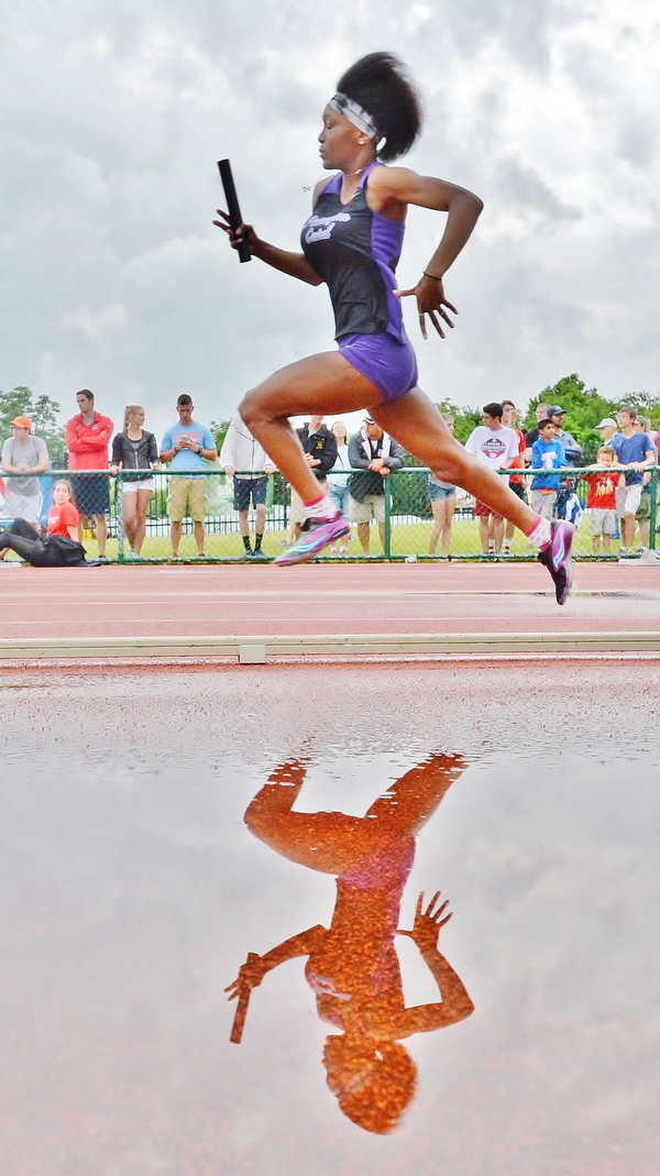 Jeff Lange | The Vindicator  SAT, JUN 4, 2016 - After a brief storm delay, Pickerington Central's Trinity Brown competes in the Division I girls 4x100 meter relay race during the OHSAA State Track and Field tournament held at Jesse Owens Memorial Stadium in Columbus on Saturday, June 4, 2016.