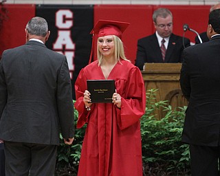 Nikos Frazier | The Vindicator..Kelly Balasko smiles after receiving her diploma from Canfield High School.
