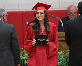 Nikos Frazier | The Vindicator..Alyssa Cross smiles after receiving her diploma from Canfield High School.