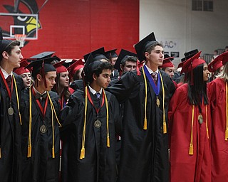 Nikos Frazier | The Vindicator..Canfield High School class of 2016 going arms as they sign their alma mater after receiving their diplomas.