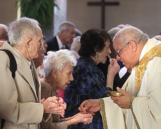 William D. Lewis\The Vindicator.John and Nancy Burke, of St Edward Parish Youngstown who have been married 66 years, receive communion from Bishop George Murry during Wedding Anniversary MassSunday June 5, 2016 at St. Columba Cathedral in Youngstown.