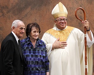 William D. Lewis\The Vindicator.Michael and Lucille Congemi of St Angela Merici parish of Youngstown pose for a photo with Bishop George Murry after Wedding Anniversary Mass Sunday June 5, 2016 at St. Columba Cathedral in Youngstown.they have been married 70 years