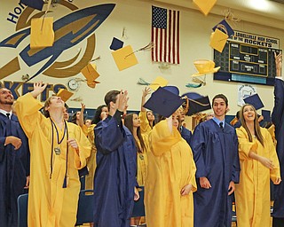 Lowellville High School graduates throw their caps in the air at the end of the Lowellville High School commencement on Sunday afternoon.   Dustin Livesay  |  The Vindicator  6/5/16  Lowellville High School.