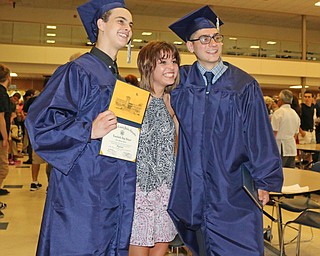 Annie Piccirillo (middle) poses for a picture with lowellville graduates Slade Bower (left) and Angelo Davanzo (right) after the Lowellville High School commencement on Sunday afternoon.   Dustin Livesay  |  The Vindicator  6/5/16  Lowellville High School.